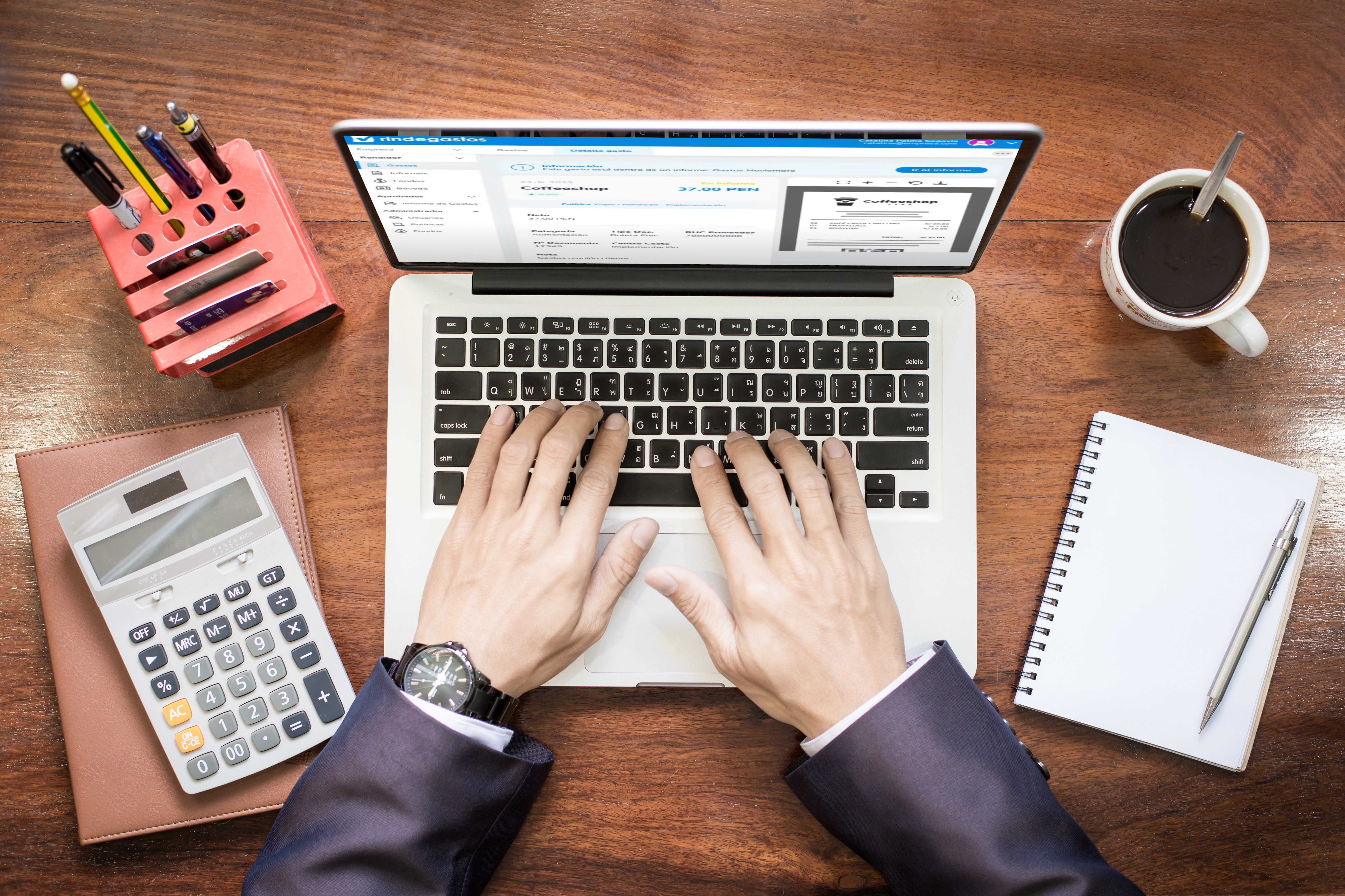 top-view-business-man-hands-working-laptop-tablet-pc-wooden-desk-1